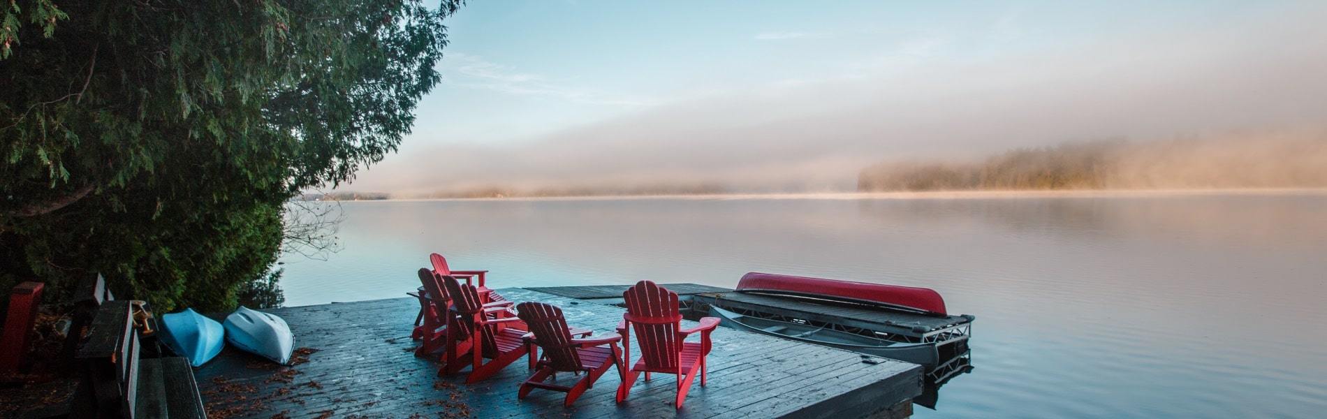 Chairs on a dock overlooking the water in Clement Lake, Ontario