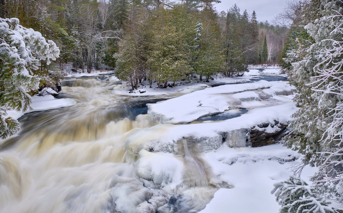 Snow melting on a river near Bancroft, Ontario