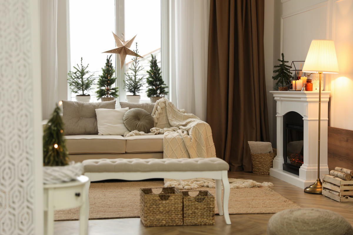 A warmly lit, winter decorated room.