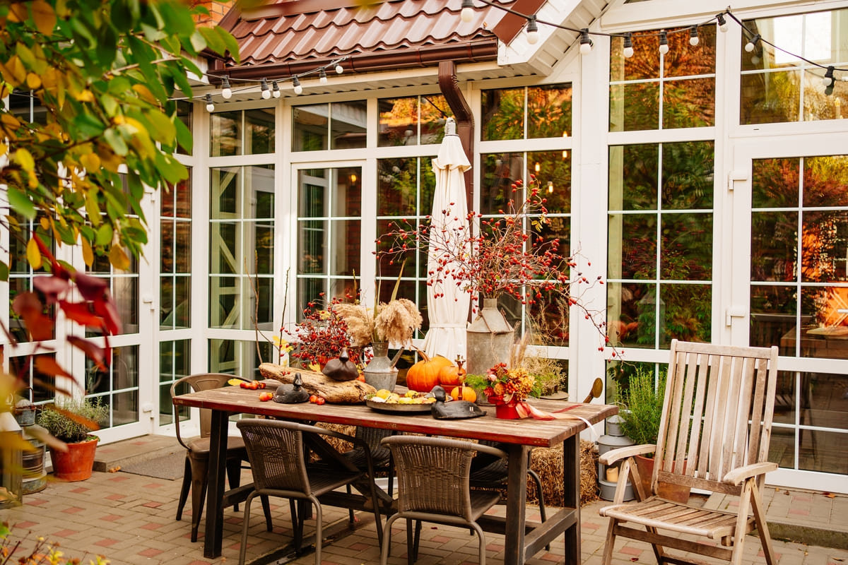 A fall decorated outdoor dining area.