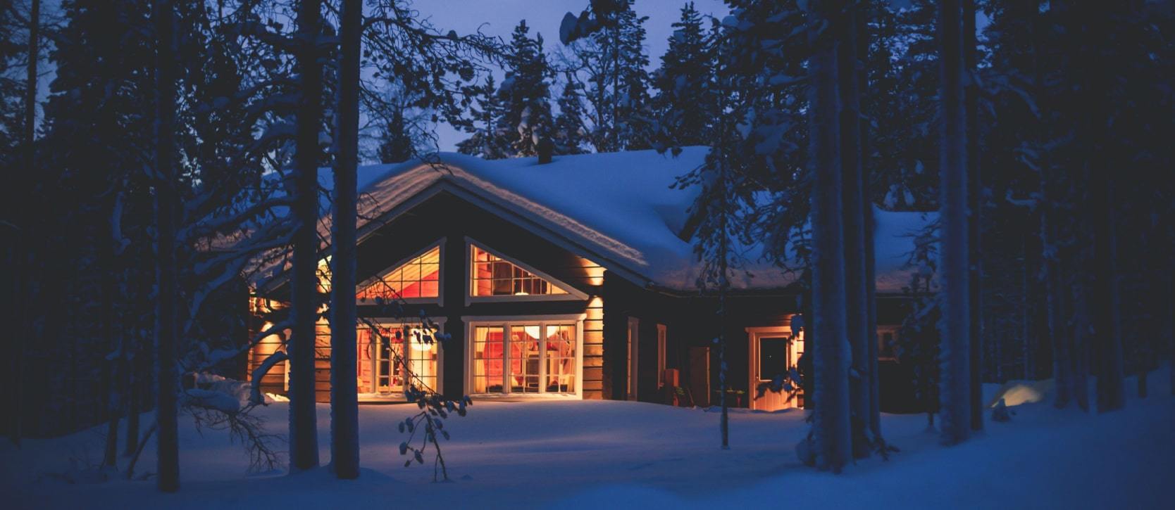 Cabin in the winter in the snow