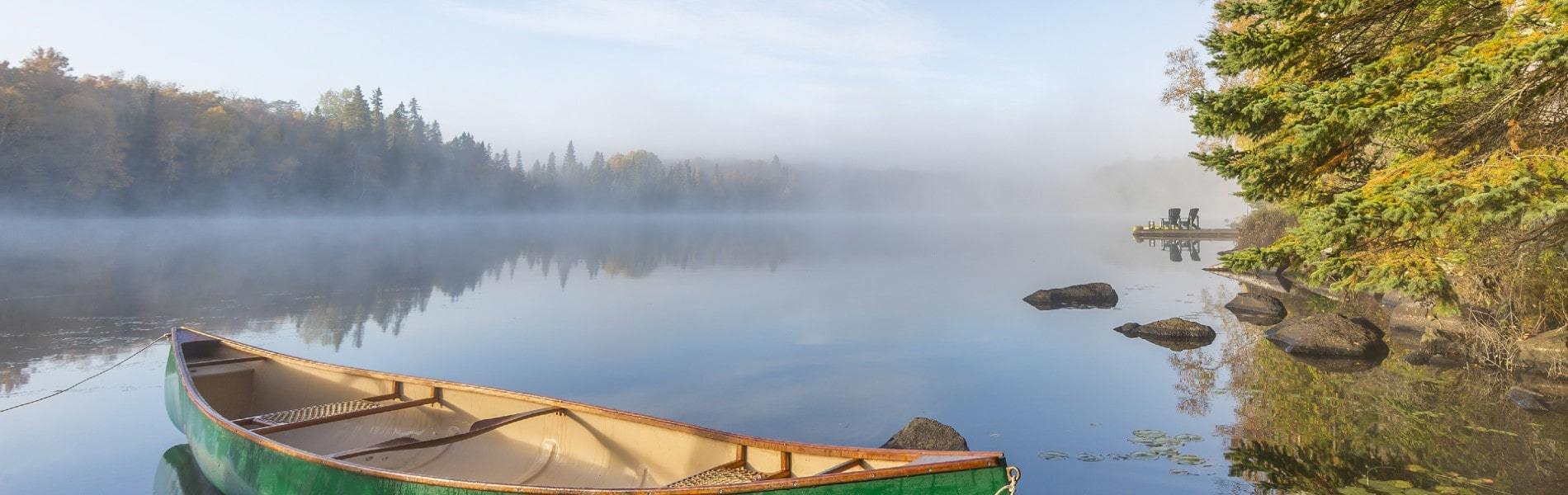 canoe floating on a lake in Haliburton, Ontario's Muskoka Lakes Region