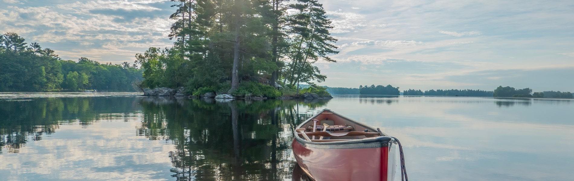 Canoe resting over peaceful waters typical of Ontario lakes
